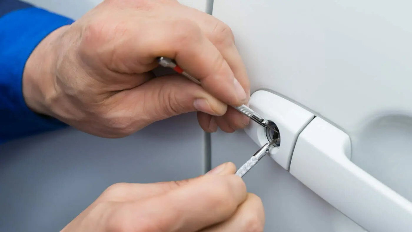 On Time Locksmith technician helping with a car lockout, reliable Locksmith Chicago solution.